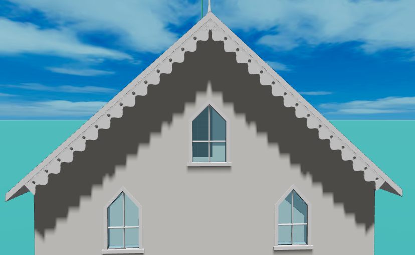 A gable end with an ogee bargeboard: S-curved cusps running into sharp points